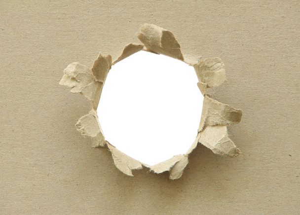 Hole in the cardboard. - Photo, Image