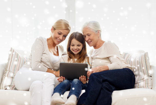 smiling family with tablet pc at home - Фото, зображення