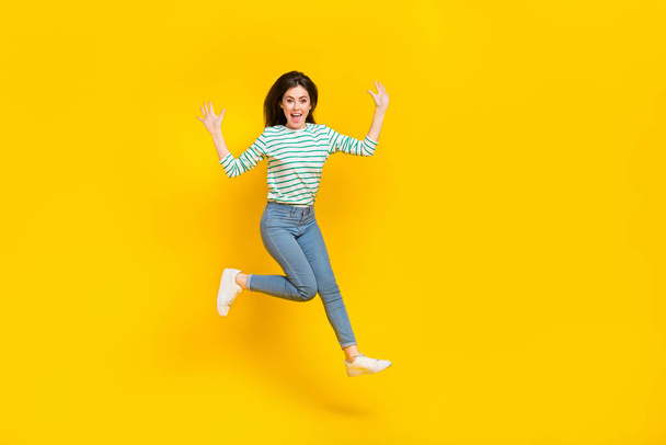 Full size photo of good mood cheerful lady traveling during summer vacation have fun isolated on yellow color background. - Fotó, kép