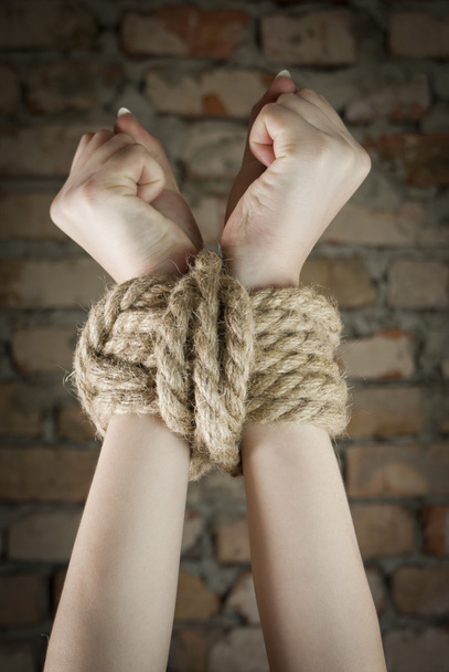 Hands tied up with rope - Foto, imagen