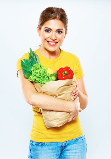 Woman holding bag with vegetarian food. - Foto, immagini