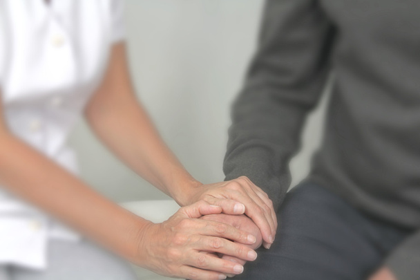 Female therapist offering comfort to patient - Photo, Image