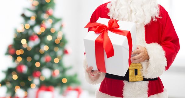 man in costume of santa claus with gift box - Фото, изображение