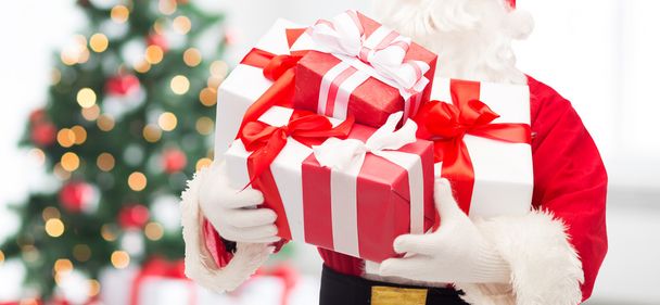 man in costume of santa claus with gift box - Photo, image