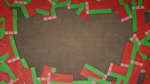 Frame made of paper flags of Belarus arranged on wooden table. National celebration concept. 3D illustration - Photo, Image