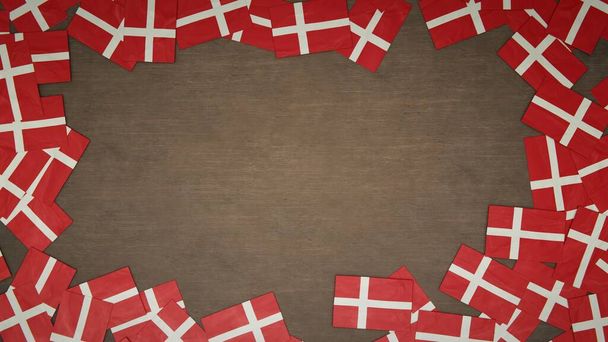 Telaio realizzato con bandiere di carta di Danimarca disposti su tavolo in legno. Concetto di celebrazione nazionale. Illustrazione 3D - Foto, immagini