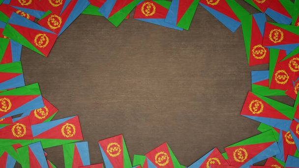 Telaio realizzato con bandiere di carta dell'Eritrea disposte su tavolo in legno. Concetto di celebrazione nazionale. Illustrazione 3D - Foto, immagini