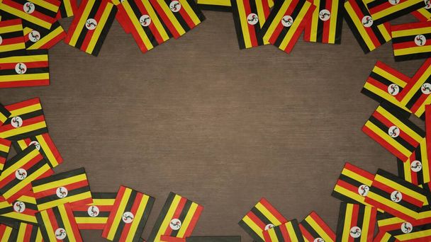 Rámeček z papírových vlajek Ugandy rozmístěných na dřevěném stole. Národní koncepce oslav. 3D ilustrace - Fotografie, Obrázek