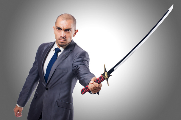 Бизнесмен с мечом
 - Фото, изображение