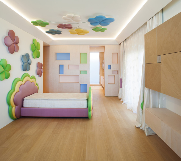 Modern minimal bedroom with coloured flowers - Foto, afbeelding