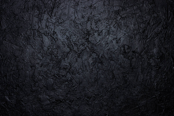 Black stone texture. Abstract dark texture. Dirty wall background or wallpaper with copy space. Grunge dark texture with scratches. Distressed black grunge seamless texture. Overlay scratched backdrop - Фото, изображение