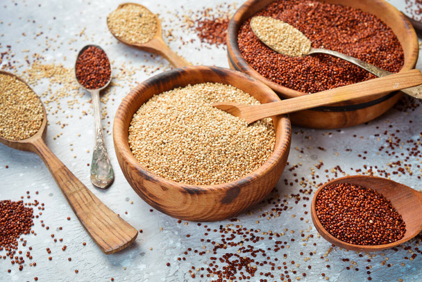 Quinoa set Red, white and brown quinoa. On a black background. Top view. Free copy space. - Foto, immagini
