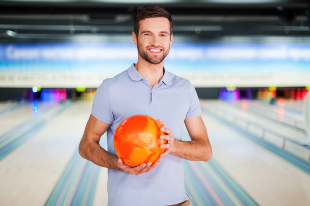 Man holding bowling ball - Photo, Image