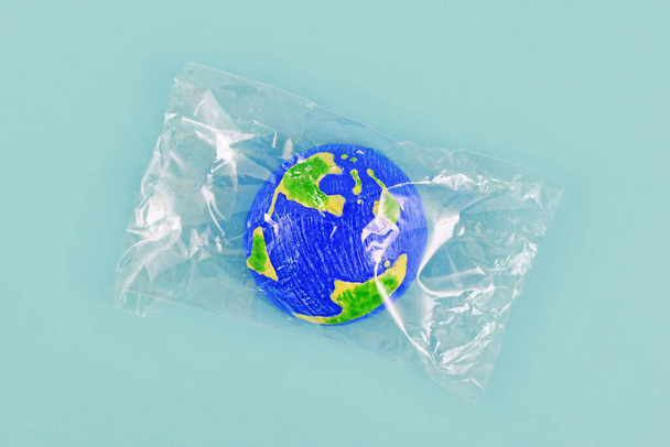 Small planet earth model wrapped in plastic - Zdjęcie, obraz
