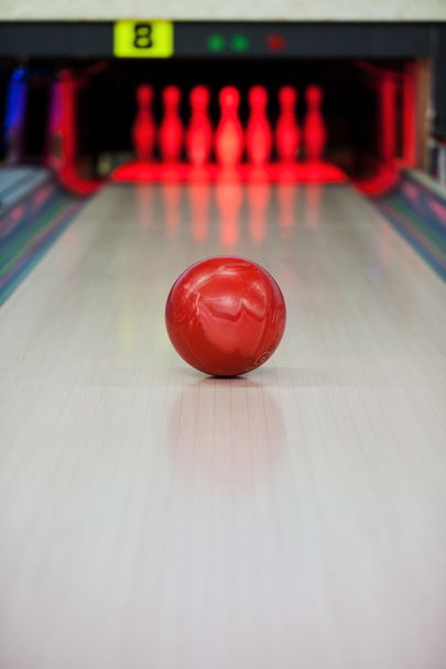 Bowling ball rolling along bowling alley - Фото, изображение