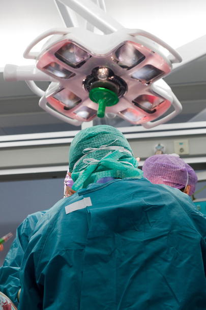 Surgeon operating in hospital - Photo, Image