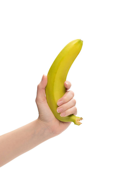 Купка бананів у жіночій руці ізольована на білому тлі
. - Фото, зображення