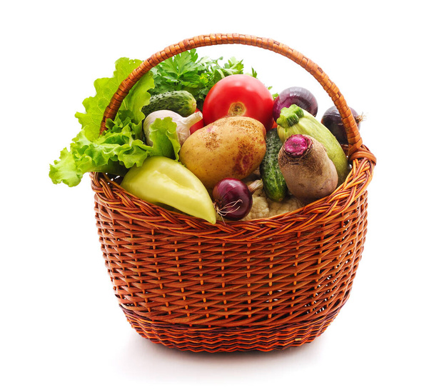 Basket with fresh vegetables isolated on a white background. - Фото, изображение