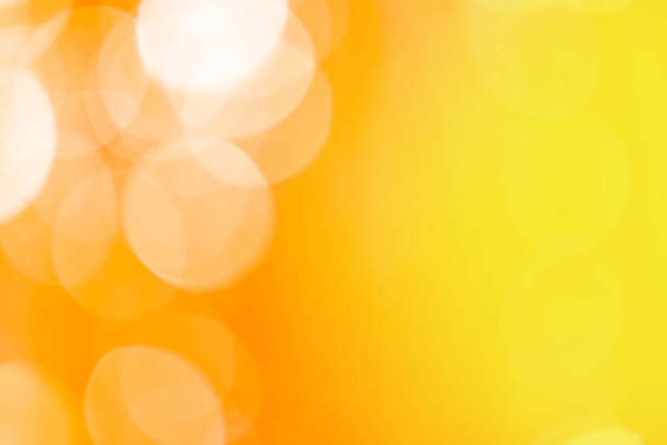 Blurry yellow orange color bokeh backdrop. Orange and yellow bokeh. - Fotó, kép