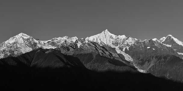 rolling snow mountains of meili range in black and white - Photo, Image