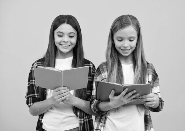 education. high school. friends girls with notebook. back to school. teens ready to study. happy childhood. cheerful kids going to do homework with books. smiling teenager student. - Photo, image
