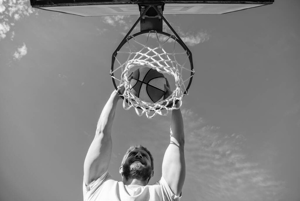 cheerful man player throw basketball ball through basket, motivation. - Photo, Image