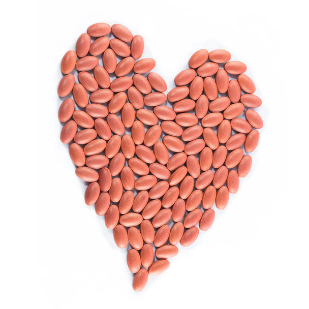 Szív alakú piros orvosi tabletták - Fotó, kép