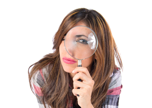 Girl magnifying glass over isolated white background - Photo, Image