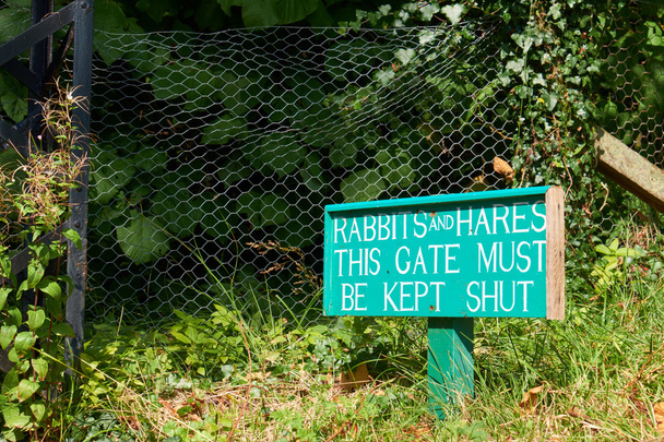 A sign warning of the problem of Rabbits and Hares - Photo, Image