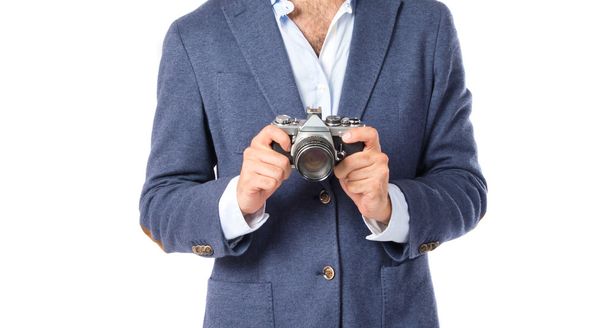 Man photographing over white background - Valokuva, kuva