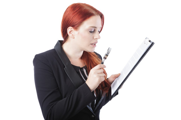 Businesswoman Reading Report with Magnifying Glass - Фото, изображение