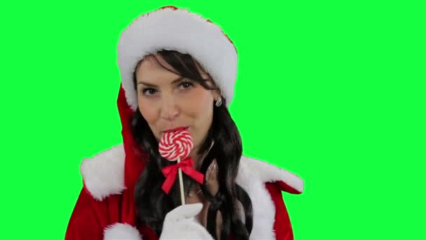 Santa κορίτσι βοηθός με καραμέλα Χριστουγέννων - Πλάνα, βίντεο