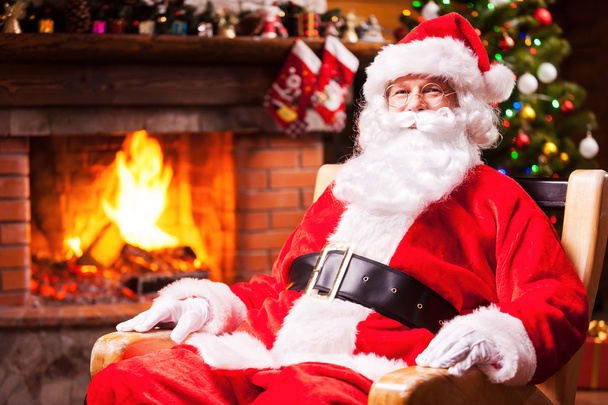 Santa Claus sitting at his chair - Photo, image