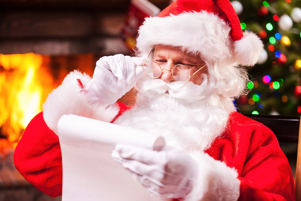 Santa Claus reading a letter - Fotó, kép