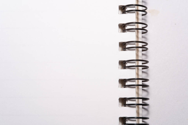 Business concept, black spiral notebook on white background  - Zdjęcie, obraz