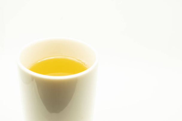 Green tea on a white background. Image of Japanese green tea. Cup of tea isolated on white background - Φωτογραφία, εικόνα