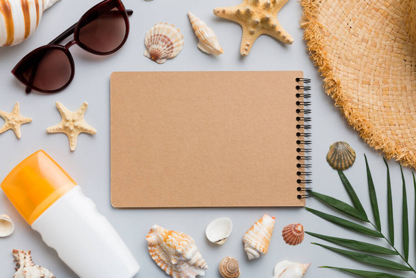 Blank writing book with summer beach accessories on background, copy space. Flat lay with copy space. - Photo, image