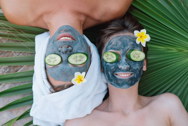 Beautiful Women getting facial care. Wellness, healing and spa relaxation concept. - Photo, Image