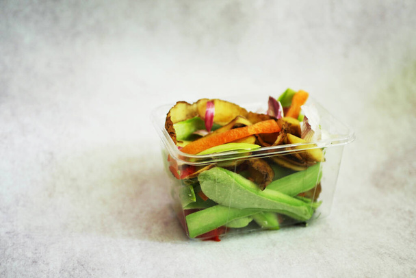 Food waste in container. Organic garbage composting concept. Sustainable lifestyle.  - Photo, Image