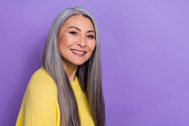 Photo of mature stunning lady with long hair visit hairdresser keratin straightening isolated on violet color background. - Fotó, kép
