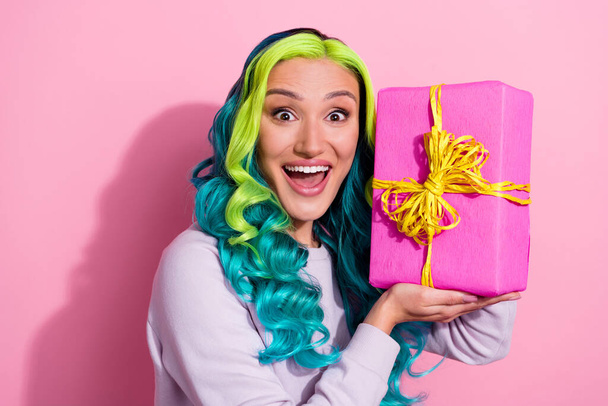 Portrait of overjoyed good mood lady receive present on her birthday isolated on pink color background. - Foto, imagen