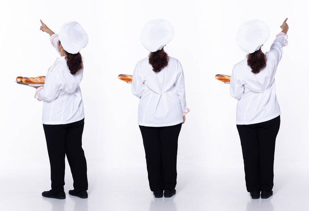 Full length 40s 50s Asian Senior Woman Cooking Chef, pointing finger up in Air, wear white formal uniform pants. Smile restaurant female stands feels smile happy over white background isolated - Foto, Bild
