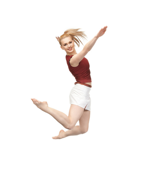 スポーティーな女の子をジャンプ - 写真・画像