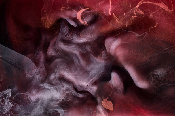 Black and red ink background, colorful fog, abstract swirling ocean, acrylic paint pigment underwater, white smoke - Fotografie, Obrázek