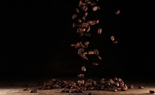 Roasted coffee beans macro close up background - 写真・画像
