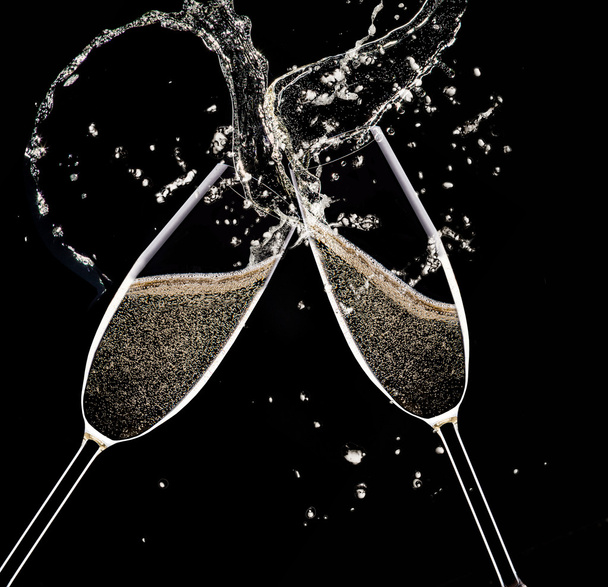 Champagne flutes on black background - Foto, afbeelding