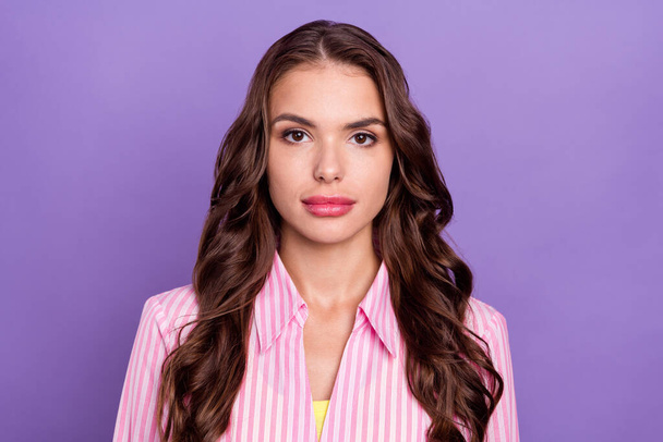 Photo portrait serious woman wearing striped shirt isolated pastel violet color background. - Фото, изображение