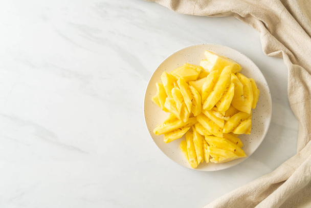 fresh pineapple sliced on white plate - Fotografie, Obrázek