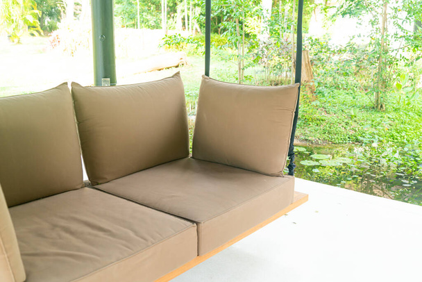 empty sofa swing in garden for relax time - Fotografie, Obrázek