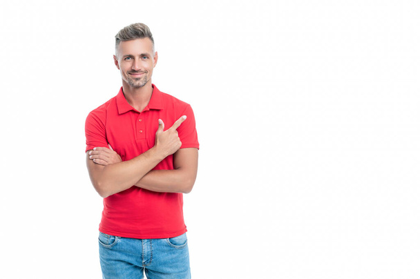 handsome man with grizzled hair in red shirt isolated on white background. directing. - Foto, Bild